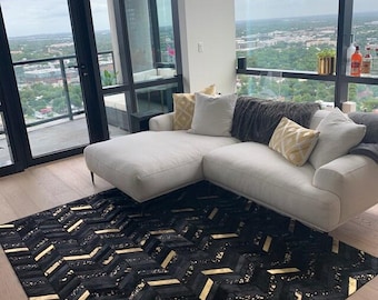 Hand Stitched Black Cowhide Rug: Metallic Gold Herringbone Pattern