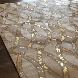 Golden and White: Hand patched and Hand stitched Cowhide Rug