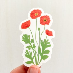 May include: A sticker featuring a cluster of red poppy flowers with green leaves and stems.