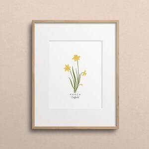 May include: A framed print with a drawing of yellow daffodils and the text "MARCH Daffodil".