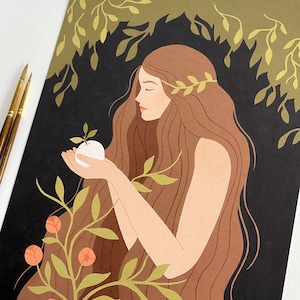 May include: A woman with long brown hair and a wreath of leaves on her head holds a white apple in her hands. She is surrounded by green leaves and branches against a dark background.