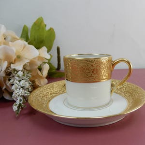 Limoges, France W.G. & Co. Encrusted Gold Demitasse Cup and Saucer