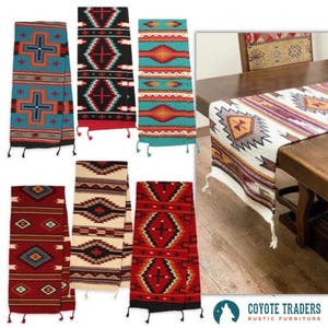May include: A collection of Southwestern-style table runners and textiles. The runners feature geometric patterns in various colors, including turquoise, red, black, and cream. Some have fringe at the ends. The image also includes the Coyote Traders logo.