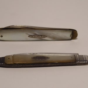 Two MOP & Sterling Silver bladed folding fruit pen knives in need of slight repair