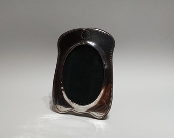 1995 Picture Frame in Sterling Silver by Ray Hall, with oak easel back and glass plate