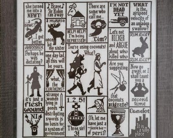 May include: Framed cross-stitch art with a grid of humorous quotes and illustrations from a movie. The artwork features black stitching on a white background, with a gray wooden frame. The text includes phrases like "I'm not dead yet" and "Run away!"