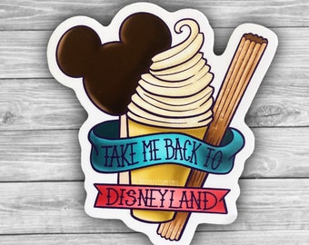 May include: A sticker with a cartoon illustration of a Mickey Mouse ice cream bar, a swirl of soft serve ice cream, and a churro. The sticker has a blue and red banner with the text "Take Me Back To Disneyland".
