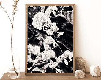 May include: Black and white abstract art print of stylized flowers in a frame. The print features a floral design with a dark background and white flowers.