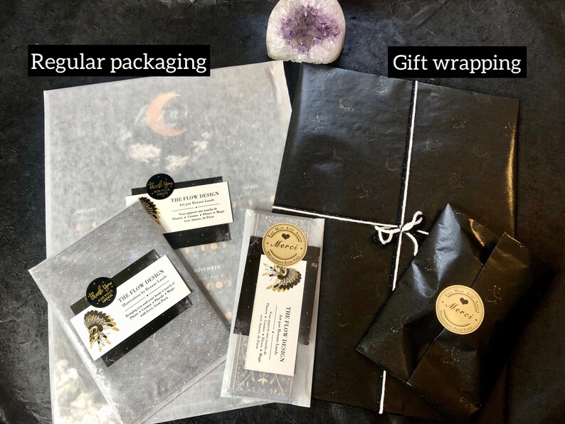 May include: Two images showing packaging options for a print. The first image shows a print wrapped in white tissue paper with a black and gold sticker that says "The Flow Design". The second image shows a print wrapped in black tissue paper with a gold sticker that says "Merci".