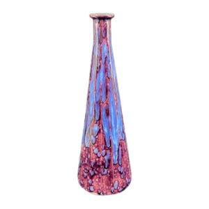 May include: A tall, conical ceramic vase featuring a glossy glaze with a deep burgundy base color and vibrant blue drips cascading from the narrow neck down the sides, creating a textured, multi-layered appearance on the tapered body.