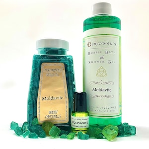 May include: A set of Moldavite bath products, including bath crystals, bubble bath and shower gel, and essential oil. The products are all green and feature the text "Ceridwen's Magical" and "Moldavite".