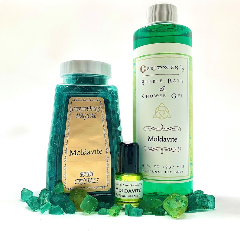 May include: A set of Moldavite bath products, including bath crystals, bubble bath and shower gel, and essential oil. The products are all green and feature the text "Ceridwen's Magical" and "Moldavite".