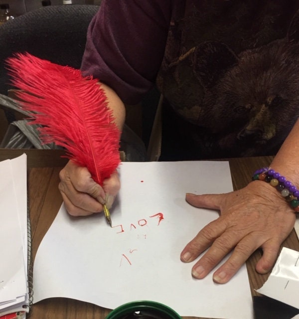 Jacquie red feather image