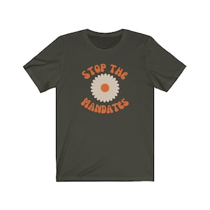 May include: A dark green t-shirt with a white daisy and the text "STOP THE MANDATES" in orange.