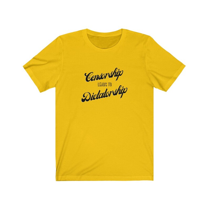 May include: Yellow t-shirt with black text that reads "Censorship Leads to Dictatorship".