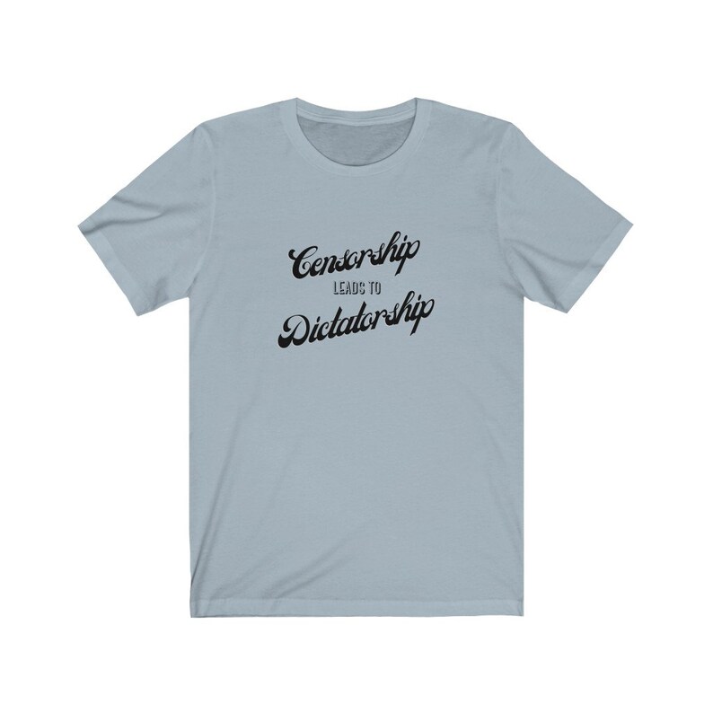 May include: Light blue t-shirt with black text that reads "Censorship Leads to Dictatorship".