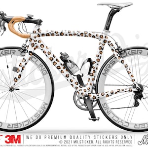 May include: A white road bike with a leopard print design. The bike has black wheels with white lettering that says "Mrsticker Cycling".