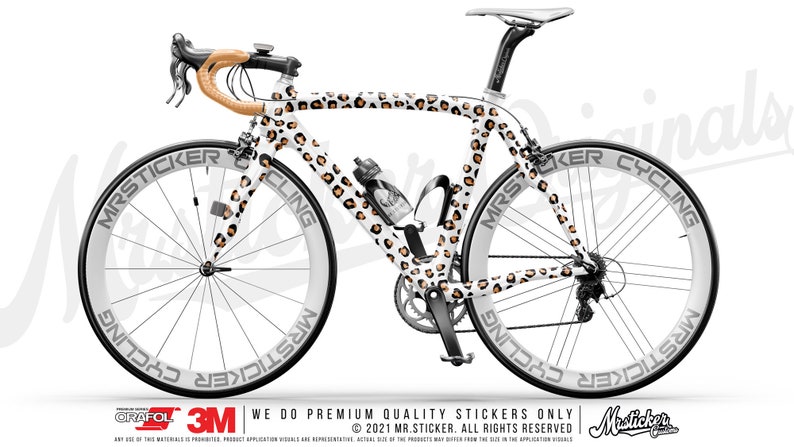 May include: A white road bike with a leopard print design. The bike has black wheels with white lettering that says "Mrsticker Cycling".