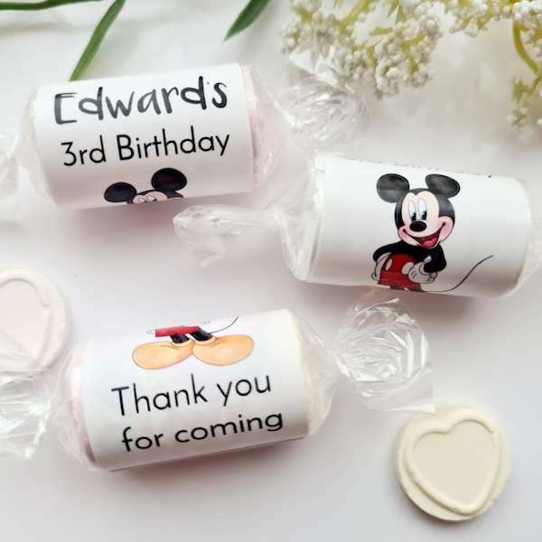 May include: Three small wrapped candies with Mickey Mouse designs. The first candy says "Edwards 3rd Birthday". The second candy has a picture of Mickey Mouse. The third candy says "Thank you for coming".