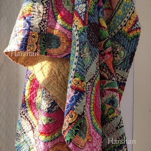 May include: A colorful patchwork quilt with a vibrant mix of patterns and colors, including pink, blue, green, and orange. The quilt features intricate stitching and the text "Harshan".