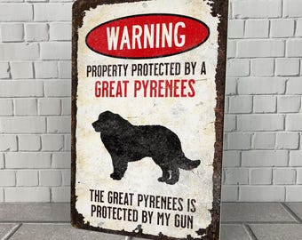 May include: A warning sign with a distressed metal look. The sign reads "WARNING PROPERTY PROTECTED BY A GREAT PYRENEES THE GREAT PYRENEES IS PROTECTED BY MY GUN". A black silhouette of a Great Pyrenees dog is in the center of the sign.