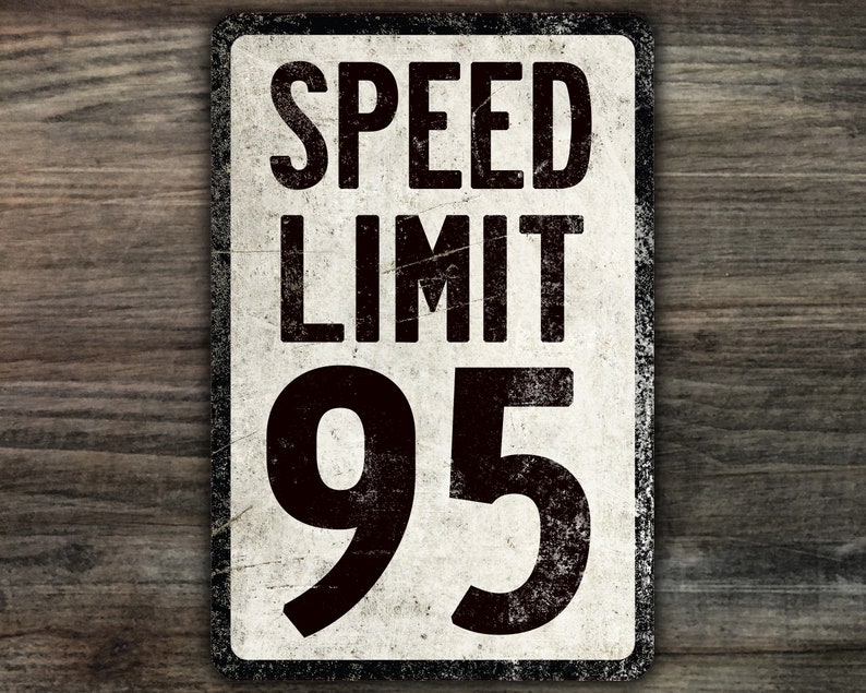 May include: A vintage-style speed limit sign with a white background and black text. The sign reads "SPEED LIMIT 95".