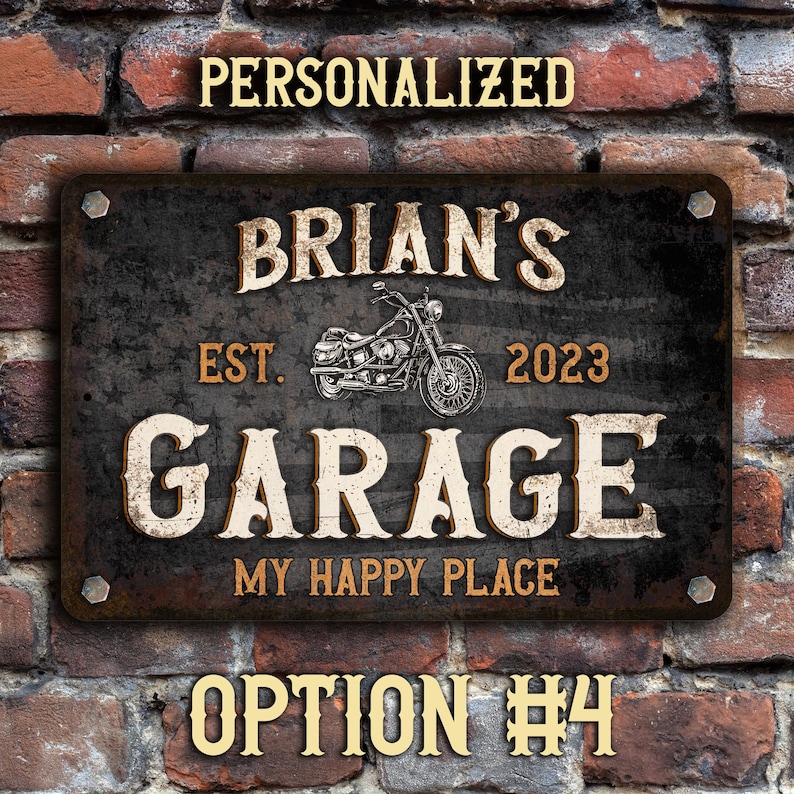 May include: Personalized garage sign with a distressed black background, white lettering, and a vintage motorcycle graphic. The sign reads "Brian's Garage Est. 2023 My Happy Place".