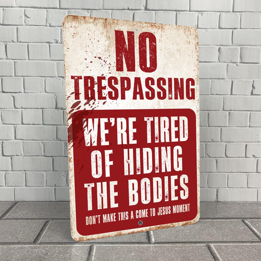 Funny Halloween Tin Sign - 12x8 Inch "We're Tired Of Hiding The Bodies" Plaque