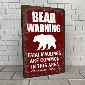 Señal de metal divertida de advertencia de oso