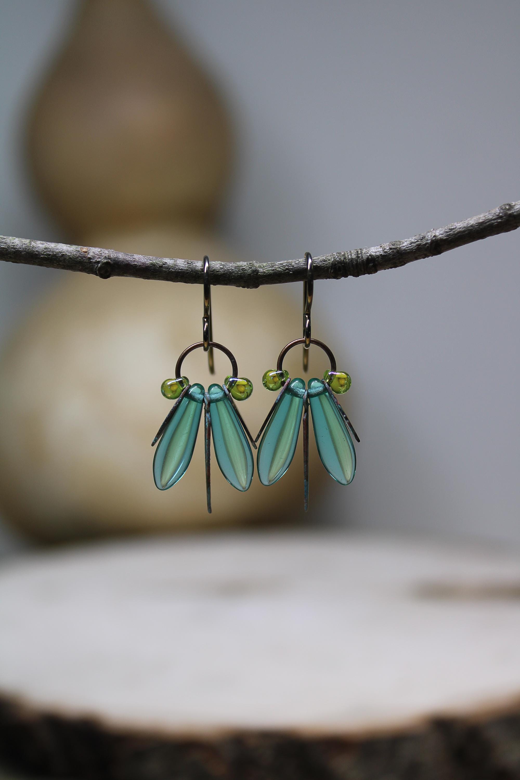 Glanzende nachtvlinder * Unieke insectenoorbellen * Interpretatief ontwerp