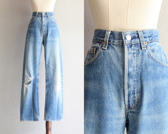 Levi's 501 ripped blue jeans / 30"