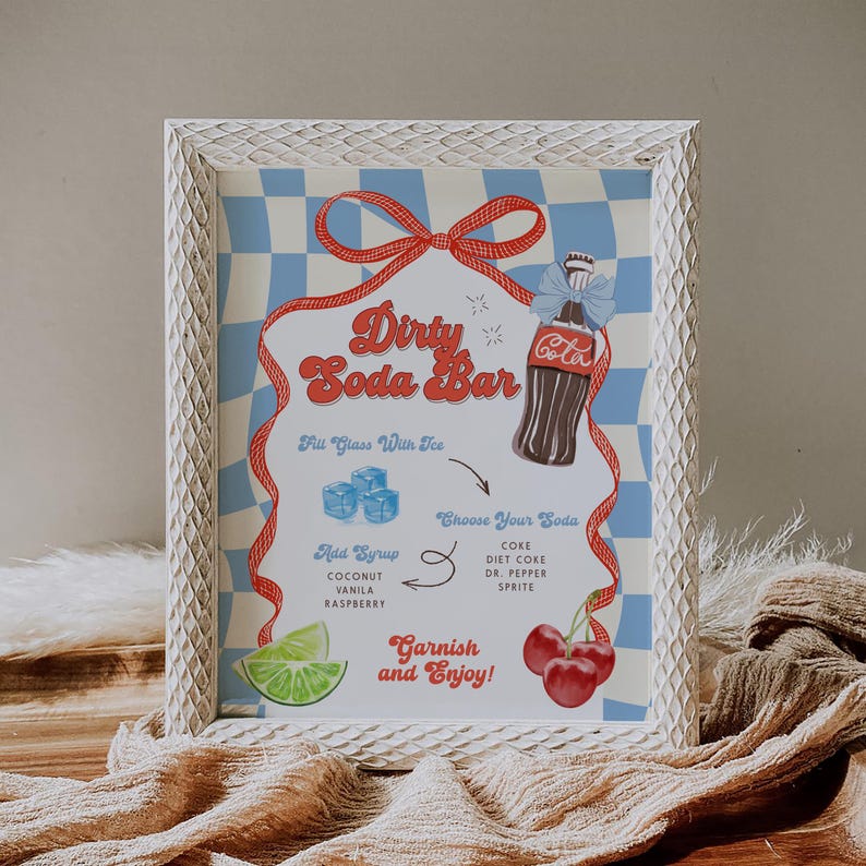 May include: A framed sign with a retro design for a "Dirty Soda Bar." The sign features a Coca-Cola bottle illustration, ice cubes, cherries, and lime. Text includes "Choose Your Soda" and "Garnish and Enjoy!" The background is a blue and white checkered pattern.