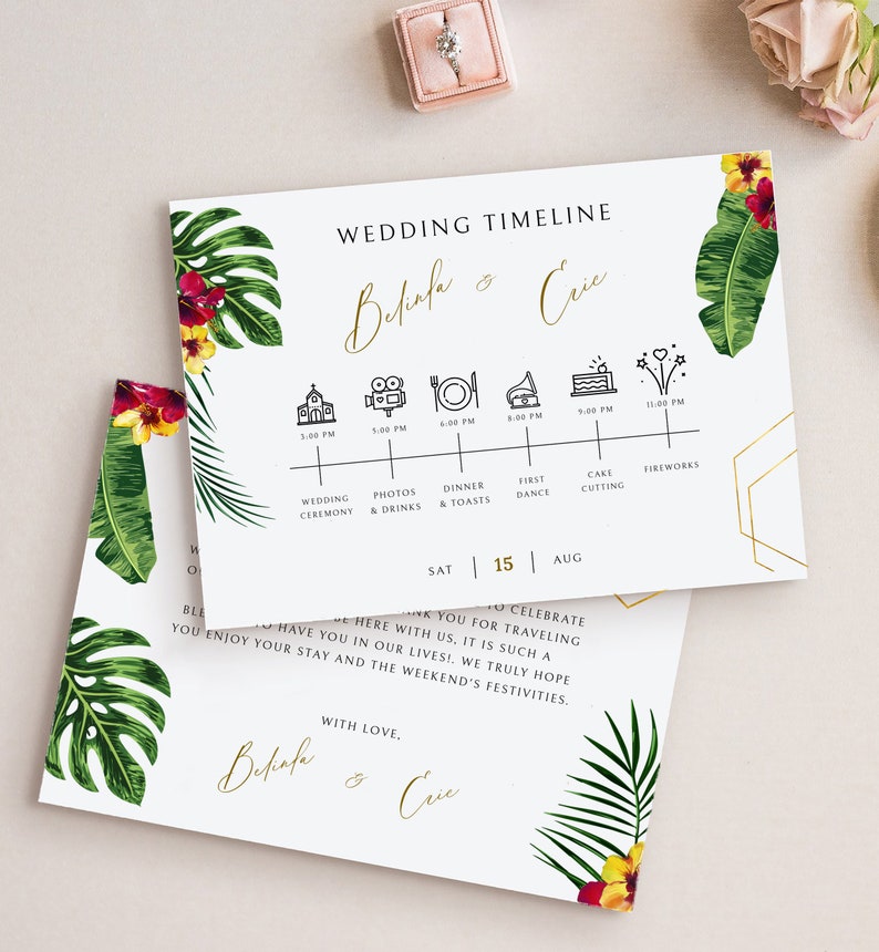 May include: A wedding timeline card with tropical leaves and flowers. The card features a timeline of events for a wedding day, including the ceremony, photos, dinner, first dance, cake cutting, and fireworks. The card also includes the names "Belinda & Eric" and the date "Sat 15 Aug".