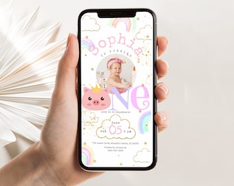 May include: A pink and purple digital invitation for a first birthday party. The invitation features a rainbow, clouds, stars, and a pig with a crown. The text on the invitation reads "Sophia is turning one" and includes the date and time of the party.