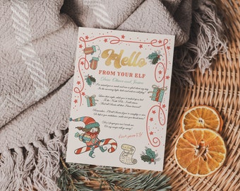 May include: A white card with red and gold lettering that says "Hello from your elf." The card has a festive design with a cartoon elf, candy canes, and presents. The text on the card reads: "Dear Oliver and Jessica, I've received your wish list and am so excited about this year. In the morning light, make sure we are all set to play. Later that night, while you're tucked in bed, I'll fly to the North Pole. I'll tell Santa all about their bravery. Remember, I'll leave Santa a note if you're naughty or nice. Oh, before you go to sleep, make sure you leave me treats. Don't forget to miss me. On my magic sleigh I will go. Love your elf!"