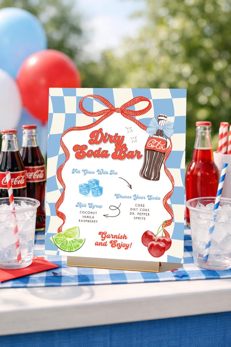 May include: A retro-style "Dirty Soda Bar" sign with a red and blue checkered background. The sign features a Coca-Cola bottle illustration, instructions, and garnishing suggestions for creating soda drinks. Red, white, and blue balloons are in the background.