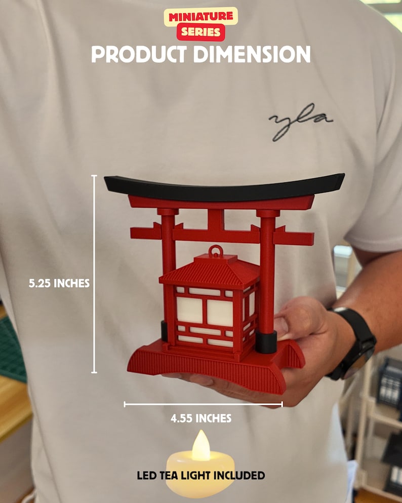 May include: A red miniature Japanese Torii gate with a lantern, measuring 5.25 inches tall and 4.55 inches wide. Includes an LED tea light. The product is part of the Miniature Series.