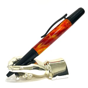 A Fascinating Hand Turned Retractable Ballpoint Pen. Black Chrome fitments. High Gloss, Glass like, Diamondcast
