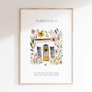 May include: A framed watercolor print featuring a white building with a yellow door and windows, surrounded by pink, yellow, and green floral accents. The text "Joshua 24:15" and a quote are displayed.