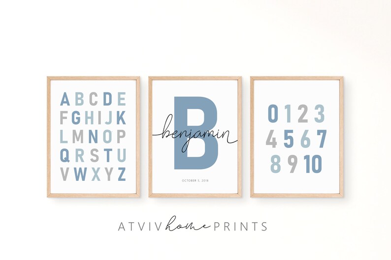 May include: Three framed prints with a blue and gray color scheme. The first print features the alphabet, the second print features the letter "B" with the name "benjamin" and the date "October 2, 2018", and the third print features the numbers 0-10.
