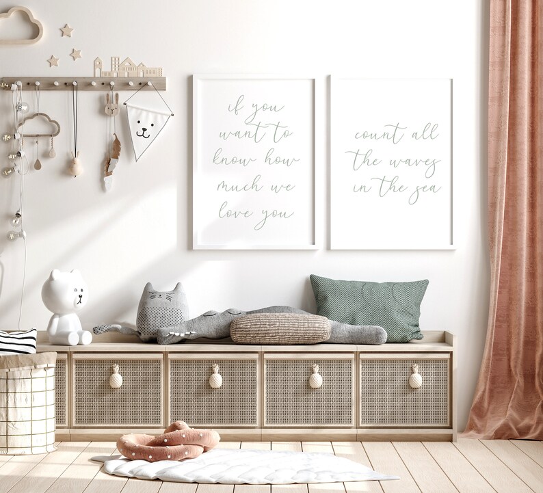 May include: Two white framed prints with grey text on a white background. The left print says "If you want to know how much we love you". The right print says "Count all the waves in the sea".
