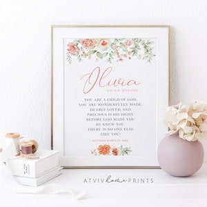 Puede incluir: Un cuadro con el nombre Olivia Grace Watson en letras rosas, rodeado de ilustraciones florales en acuarela. El texto dice: You are a child of God. You are wonderfully made, dearly loved, and precious in His sight. Before God made you He knew you. There is no one else like you! Baptized March 25, 2022.