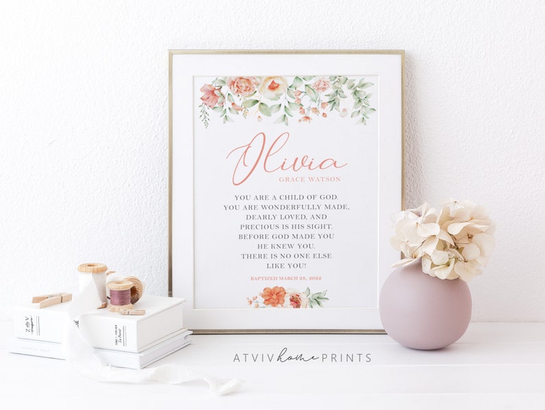 Puede incluir: Un cuadro con el nombre Olivia Grace Watson en letras rosas, rodeado de ilustraciones florales en acuarela. El texto dice: You are a child of God. You are wonderfully made, dearly loved, and precious in His sight. Before God made you He knew you. There is no one else like you! Baptized March 25, 2022.