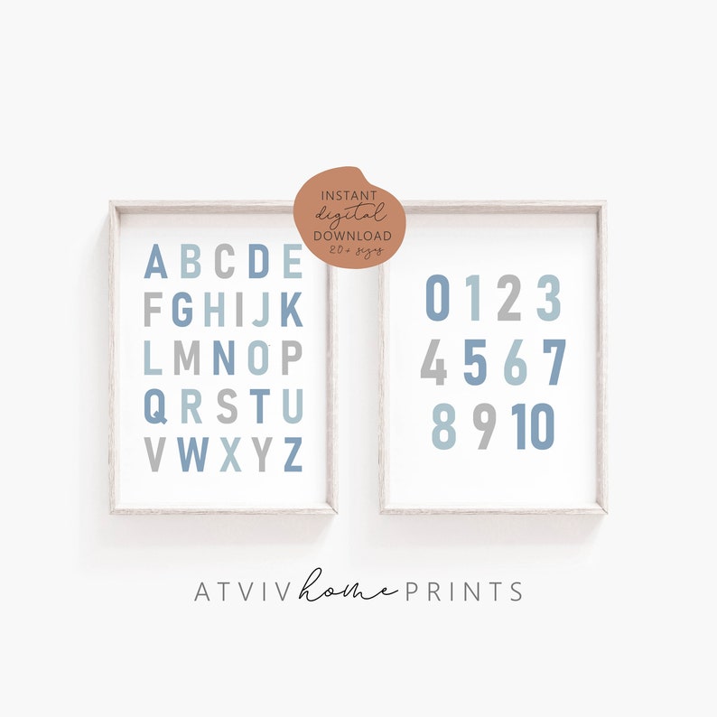 May include: Two printable posters with a white background and a light wood frame. The poster on the left features the alphabet in blue and gray letters. The poster on the right features the numbers 0-10 in blue and gray numbers. The text "INSTANT digital DOWNLOAD 20+ sizes" is in a brown circle on the top of the image. The text "ATVIV home PRINTS" is at the bottom of the image.