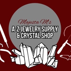 May include: A white circle with the text "Majesta M's A-Z Jewelry Supply & Crystal Shop" on a red background. The image also includes various jewelry making tools, including a saw, pliers, and a file. There are also several white crystal shapes.