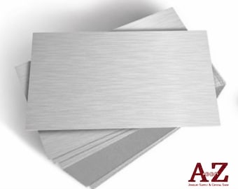 Op de afbeelding: Een stapel rechthoekige zilverkleurige metalen platen met een geborstelde afwerking. De platen liggen op elkaar gestapeld en tonen een consistente metalen textuur en strakke, rechte randen. Het logo A-Z Jewelry Supply & Crystal Shop is zichtbaar.