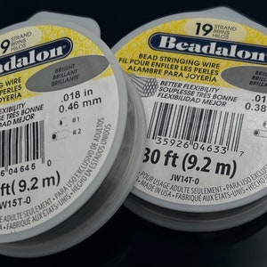May include: Two spools of 19 strand Beadalon bead stringing wire. Each spool is 30 feet (9.2 meters) long. The wire is .018 inches (0.46 mm) and .015 inches (0.38 mm) in diameter. The spools are labeled "Better Flexibility" and "Bright, Brillant, Brillante".