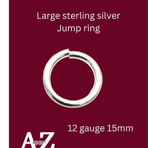 May include: A large sterling silver jump ring, 12 gauge and 15mm in diameter, against a dark red background. The ring is circular and has a small gap. The text "AZ Jewelry Supply & Crystal Shop" is at the bottom.
