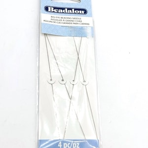 May include: Package of four silver beading needles with large eyes. The package is labeled "Beadalon Big Eye Beading Needle" and "4 pc/pz".