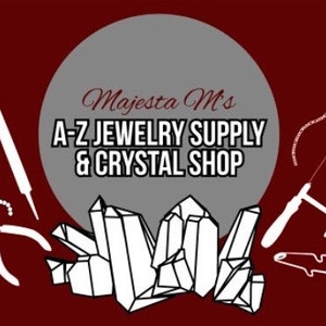 May include: A dark red graphic featuring a gray circle with the text Majesta M's A-Z JEWELRY SUPPLY & CRYSTAL SHOP. Surrounding the circle are white line art illustrations of jewelry pliers, a metal file, a jeweler's saw, and crystal clusters.